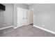 Neutral bedroom with gray walls, carpeted floor, and a closet with bi-fold doors at 5333 Abbey Park Loop, Myrtle Beach, SC 29579