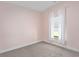 Bedroom with neutral carpeting, soft pink walls and natural light, perfect for rest and relaxation at 5333 Abbey Park Loop, Myrtle Beach, SC 29579