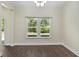 Dining area with hardwood floors, lots of light, and views of the outdoor landscape at 5333 Abbey Park Loop, Myrtle Beach, SC 29579