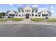 Stately house featuring unique architectural design, manicured lawns, and a grand entrance at 5333 Abbey Park Loop, Myrtle Beach, SC 29579