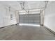 Spacious garage with concrete floor providing ample space for parking and storage at 5333 Abbey Park Loop, Myrtle Beach, SC 29579