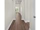 Hallway featuring wood flooring leading into a living space bathed in natural light at 5333 Abbey Park Loop, Myrtle Beach, SC 29579