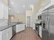 Updated kitchen with white cabinets, granite countertops, and stainless steel appliances at 5333 Abbey Park Loop, Myrtle Beach, SC 29579