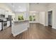 Open floor plan showcasing hardwood floors, neutral paint, and a kitchen bar at 5333 Abbey Park Loop, Myrtle Beach, SC 29579