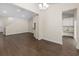Spacious living room with hardwood floors connecting to the kitchen with granite countertops at 5333 Abbey Park Loop, Myrtle Beach, SC 29579
