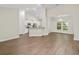 Open floor plan featuring hardwood floors, neutral paint, and lots of natural light at 5333 Abbey Park Loop, Myrtle Beach, SC 29579