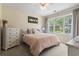 Cozy bedroom with a queen-sized bed, neutral colors, and bright natural light at 5801 Oyster Catcher Dr. # 912, North Myrtle Beach, SC 29582