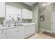 Kitchen with stainless steel sink, white cabinets, dishwasher, and neutral tile flooring at 5801 Oyster Catcher Dr. # 912, North Myrtle Beach, SC 29582