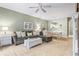 Comfortable living room with sectional sofa, ceiling fan, and neutral decor at 5801 Oyster Catcher Dr. # 912, North Myrtle Beach, SC 29582