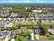 Scenic aerial view featuring a serene pond and a house with solar panels in a beautiful coastal community at 584 Circle Dr., Surfside Beach, SC 29575