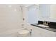 Updated bathroom featuring a black countertop, white subway tile, and modern fixtures at 584 Circle Dr., Surfside Beach, SC 29575
