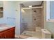 Updated bathroom featuring a glass shower with seating and sleek fixtures at 584 Circle Dr., Surfside Beach, SC 29575