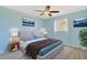 Stylishly decorated bedroom with a ceiling fan, a picture window, and matching furniture at 584 Circle Dr., Surfside Beach, SC 29575