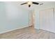Bedroom with a ceiling fan, plank flooring and a double door closet at 584 Circle Dr., Surfside Beach, SC 29575