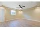 Bedroom features wood-look floors, a ceiling fan, and natural light from a single window at 584 Circle Dr., Surfside Beach, SC 29575