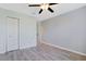 Bedroom with plank flooring, a double door closet, and ample space at 584 Circle Dr., Surfside Beach, SC 29575