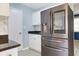 Stainless steel refrigerator stands in the kitchen against white cabinets and granite countertops at 584 Circle Dr., Surfside Beach, SC 29575
