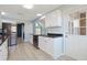 The kitchen with stainless steel appliances, granite countertops, and stylish new flooring at 584 Circle Dr., Surfside Beach, SC 29575