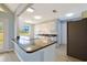 Modern kitchen with granite countertops, white cabinets, and stainless steel appliances at 584 Circle Dr., Surfside Beach, SC 29575