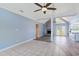 Open-concept living room with vaulted ceilings, fireplace, and transitions to the kitchen at 584 Circle Dr., Surfside Beach, SC 29575
