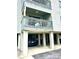 Balcony with seating, and parking underneath the raised beach condo building at 6000 Ocean Blvd. N # 108, North Myrtle Beach, SC 29582