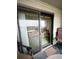 View of the balcony featuring outdoor seating and a sliding glass door leading to an indoor sitting area at 6000 Ocean Blvd. N # 108, North Myrtle Beach, SC 29582