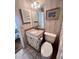 Bright bathroom with updated granite vanity, framed mirror, toilet and shower at 6000 Ocean Blvd. N # 108, North Myrtle Beach, SC 29582