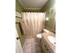 Cozy bathroom with a shower, toilet, and a granite countertop sink with cabinet storage at 6000 Ocean Blvd. N # 108, North Myrtle Beach, SC 29582