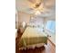 Inviting bedroom with a queen bed, ceiling fan, lamps, and hardwood floors at 6000 Ocean Blvd. N # 108, North Myrtle Beach, SC 29582