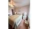 Inviting bedroom featuring a queen bed, wicker dressers, a ceiling fan, and laminate wood flooring at 6000 Ocean Blvd. N # 108, North Myrtle Beach, SC 29582