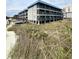 Seaside condos on stilts offer covered parking and scenic views of the beach at 6000 Ocean Blvd. N # 108, North Myrtle Beach, SC 29582