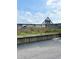 Exterior view captures a building entrance and landscaped grounds at 6000 Ocean Blvd. N # 108, North Myrtle Beach, SC 29582