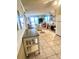 Bright living room with ocean view, dining area, and tile flooring at 6000 Ocean Blvd. N # 108, North Myrtle Beach, SC 29582