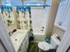 Bathroom with a tub shower combo, white vanity and coastal themed decor at 6001 - 1322 S Kings Hwy., Myrtle Beach, SC 29575