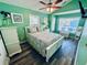 Bright bedroom with a beachy, fresh feel featuring ample natural light and a ceiling fan at 6001 - 1322 S Kings Hwy., Myrtle Beach, SC 29575