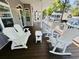 Exterior patio area with comfortable rocking chairs for relaxation and conversation at 6001 - 1322 S Kings Hwy., Myrtle Beach, SC 29575