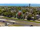 Aerial view of a cozy house nestled among mature trees, close to beach, highway and local buildings at 6001-8050 S Kings Hwy., Myrtle Beach, SC 29575