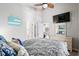 Comfortable bedroom featuring a gray bed and beach-themed artwork at 6001-8050 S Kings Hwy., Myrtle Beach, SC 29575