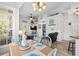 Charming dining area with beach-themed decor, white chairs, and hardwood floors at 6001-8050 S Kings Hwy., Myrtle Beach, SC 29575