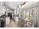Charming dining area with a sliding glass door, complemented by stylish decor and plenty of natural light at 6001-8050 S Kings Hwy., Myrtle Beach, SC 29575