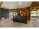 Ground level entertainment area with custom wooden bar and porch swings underneath the elevated home at 6001-8050 S Kings Hwy., Myrtle Beach, SC 29575