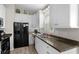 Well-equipped kitchen with white cabinets and modern appliances at 6001-8050 S Kings Hwy., Myrtle Beach, SC 29575