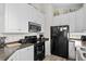 Stylish kitchen showcasing white cabinets, stainless steel appliances, and modern countertops at 6001-8050 S Kings Hwy., Myrtle Beach, SC 29575