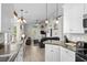 Open-concept kitchen flowing into dining and living room at 6001-8050 S Kings Hwy., Myrtle Beach, SC 29575