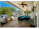 Inviting covered outdoor living area with ample seating, ceiling fans, and a stainless steel grill for relaxed entertaining at 6001-8050 S Kings Hwy., Myrtle Beach, SC 29575