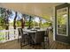 Covered outdoor seating area with a dining table for six, overlooking a street view at 6001-8050 S Kings Hwy., Myrtle Beach, SC 29575