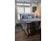 Cozy bedroom with white walls, plantation shutters and blue bedding and decor at 6001-Z55 South Kings Hwy., Myrtle Beach, SC 29575