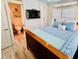 Cozy bedroom with white walls, TV, closet and blue bedding and decor and connecting bathroom at 6001-Z55 South Kings Hwy., Myrtle Beach, SC 29575