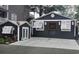 Charming home featuring a boat dock, a wall decorated with greenery, and a quaint shed at 6001-Z55 South Kings Hwy., Myrtle Beach, SC 29575