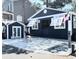 Dark blue home exterior with gray driveway and detached garage at 6001-Z55 South Kings Hwy., Myrtle Beach, SC 29575